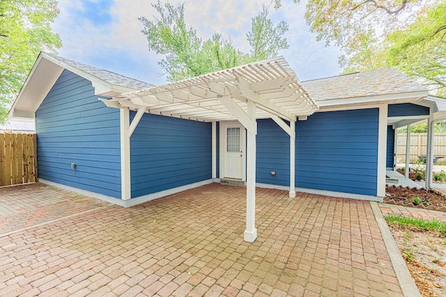 1013 Gloria Ave, Fort Walton Beach, FL 32547 - view of front of property featuring fence, a patio area, a pergola, and roof with shingles