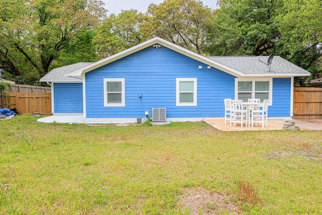 1013 Gloria Ave, Fort Walton Beach, FL 32547 - rear view of house with central air condition unit, a patio, and roof with shingles