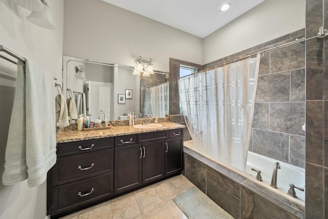 bathroom with tile patterned flooring, shower / bath combo, and vanity