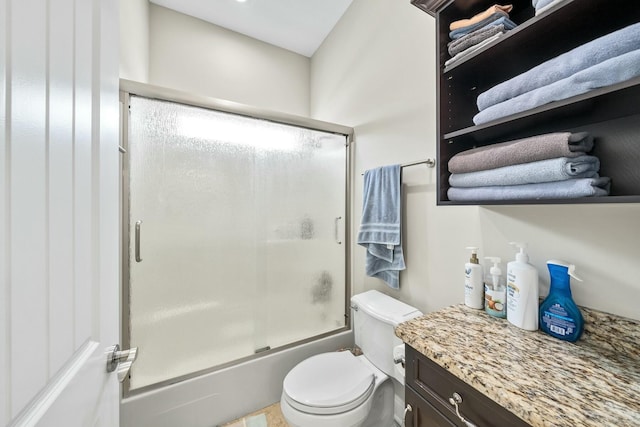 full bathroom with shower / bath combination with glass door, vanity, and toilet