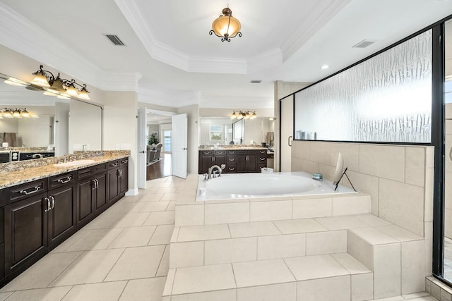 bathroom featuring plus walk in shower, tile patterned flooring, crown molding, a tray ceiling, and vanity