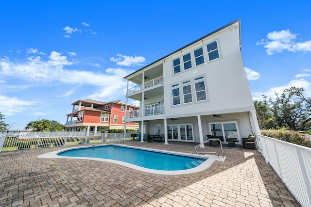 view of pool featuring ceiling fan and a patio