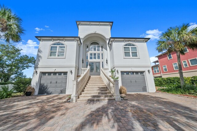 view of front of property with french doors and a garage