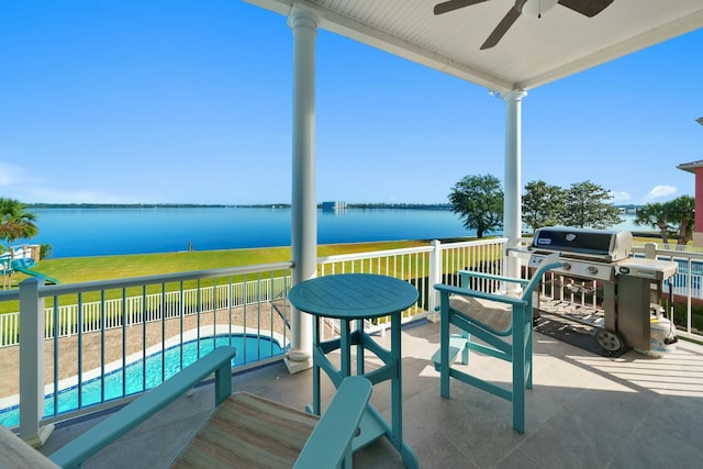 view of patio / terrace with a water view, area for grilling, ceiling fan, and a fenced in pool