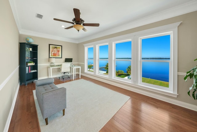 office featuring ceiling fan, dark wood-type flooring, and ornamental molding