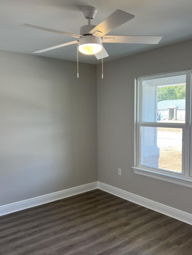 unfurnished room featuring ceiling fan and dark hardwood / wood-style floors