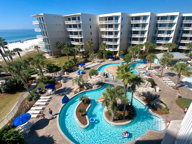 view of pool featuring a water view