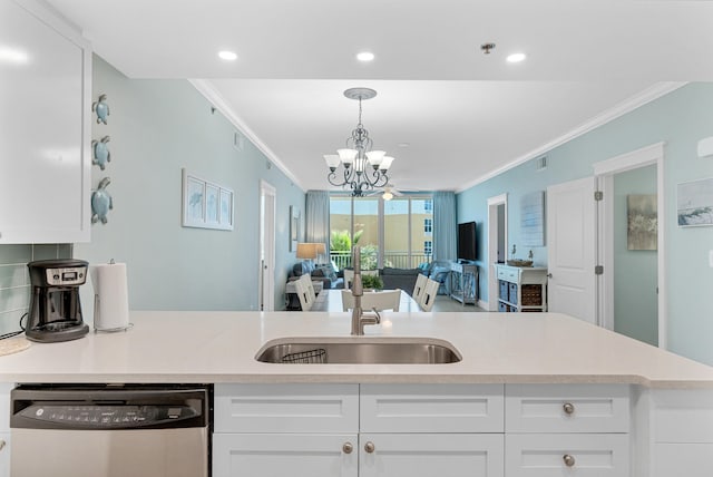 kitchen featuring a notable chandelier, dishwasher, white cabinetry, and ornamental molding