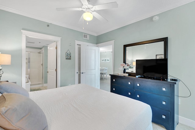 bedroom with ceiling fan, crown molding, and ensuite bath