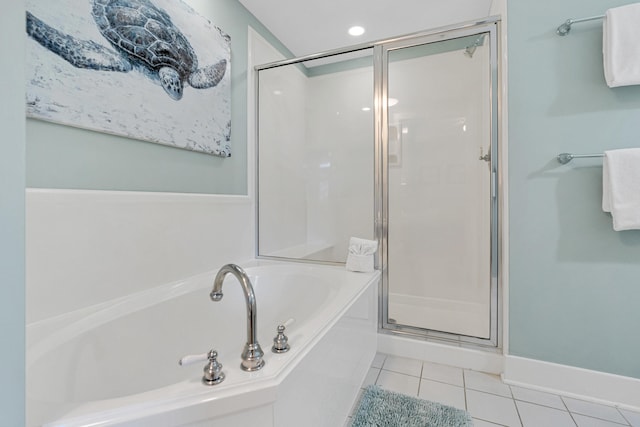 bathroom featuring tile patterned flooring and plus walk in shower