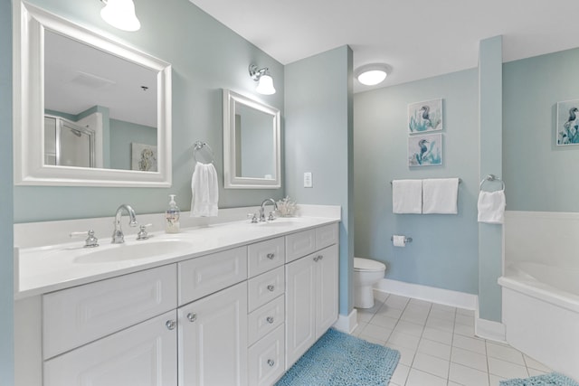 full bathroom featuring tile patterned flooring, vanity, shower with separate bathtub, and toilet