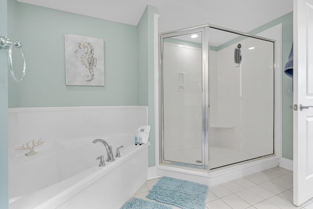 bathroom featuring tile patterned flooring and plus walk in shower