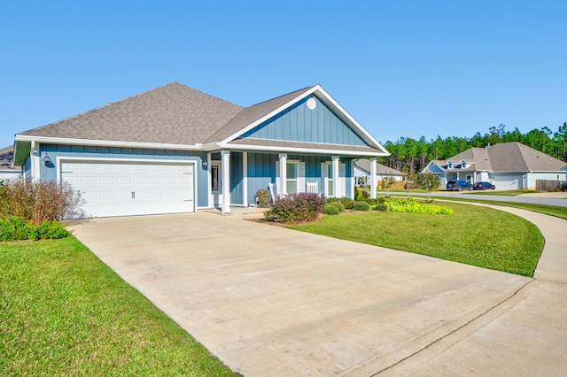 craftsman-style house with a garage and a front lawn