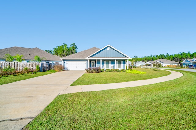 view of front of house featuring a front yard and a garage