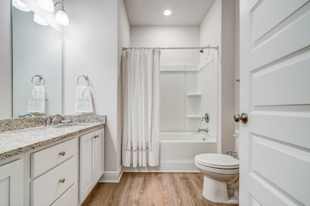 full bathroom featuring shower / bath combo, toilet, wood-type flooring, and vanity