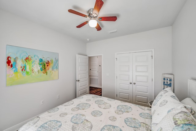 bedroom featuring ceiling fan and a closet