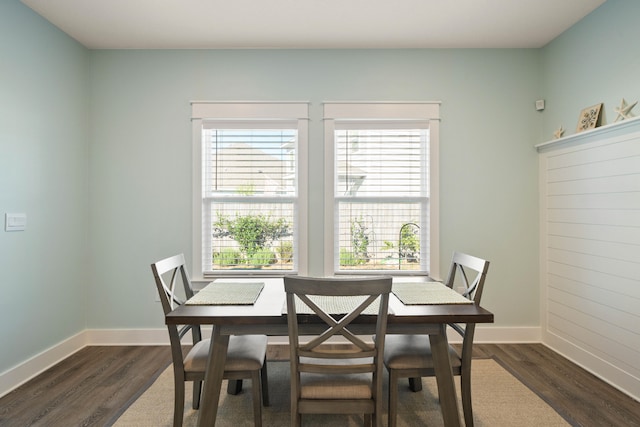 dining room with dark wood-type flooring