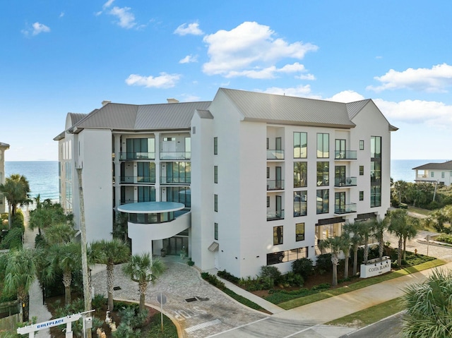 view of building exterior with a water view