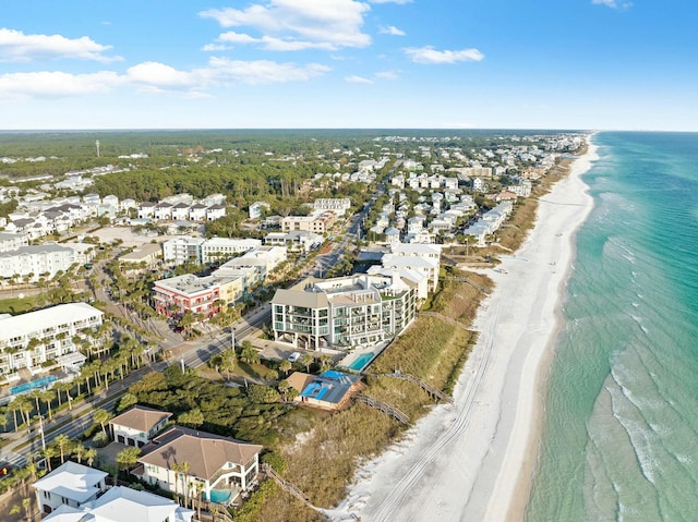 drone / aerial view featuring a water view and a beach view