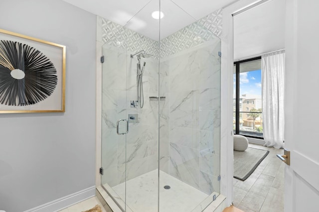 bathroom with tile patterned flooring and walk in shower