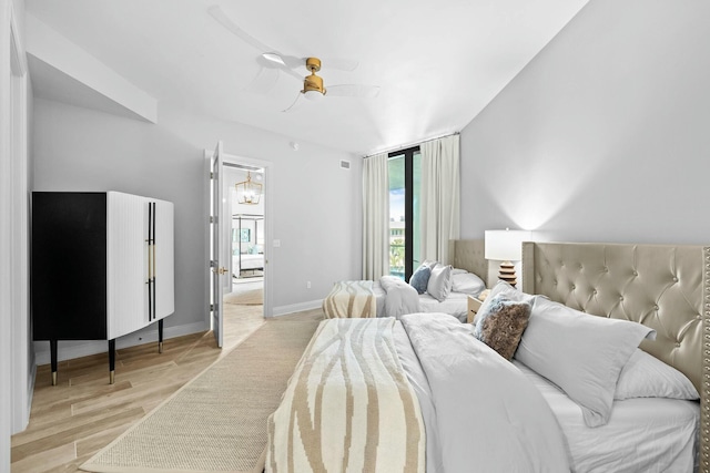 bedroom featuring ceiling fan and light wood-type flooring