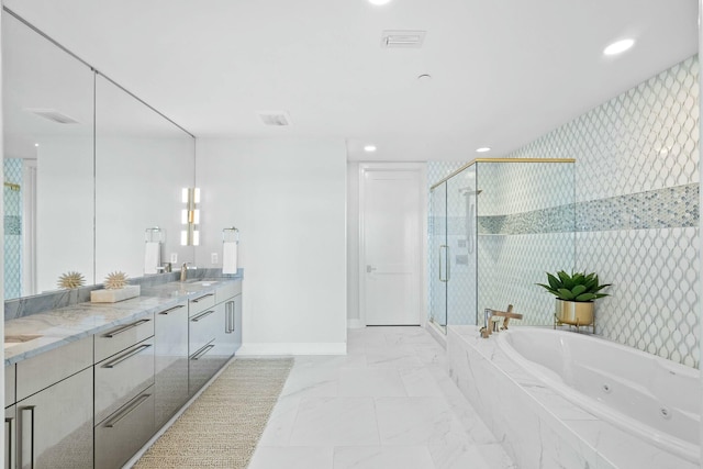 bathroom featuring vanity and separate shower and tub