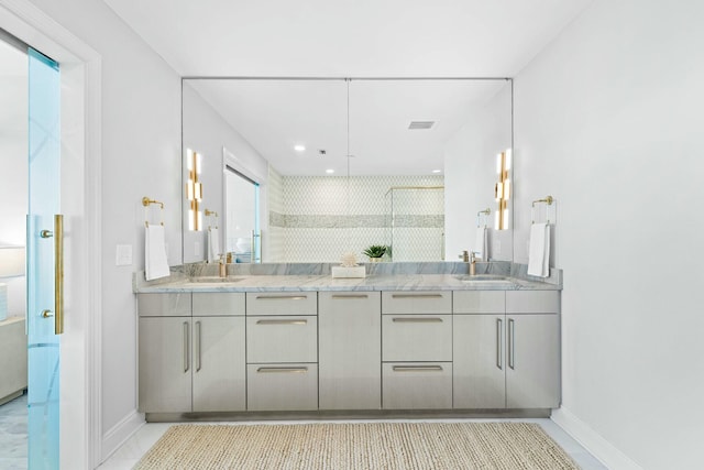 bathroom with vanity and a shower with shower door