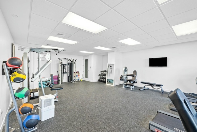 exercise room featuring a paneled ceiling