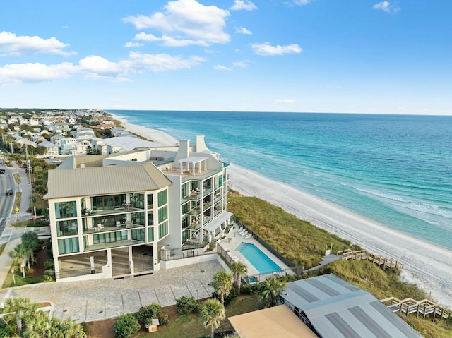 drone / aerial view featuring a view of the beach and a water view