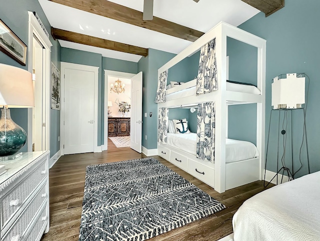 bedroom featuring beamed ceiling and dark hardwood / wood-style flooring