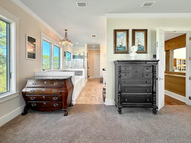 bedroom with ornamental molding, light carpet, and a chandelier