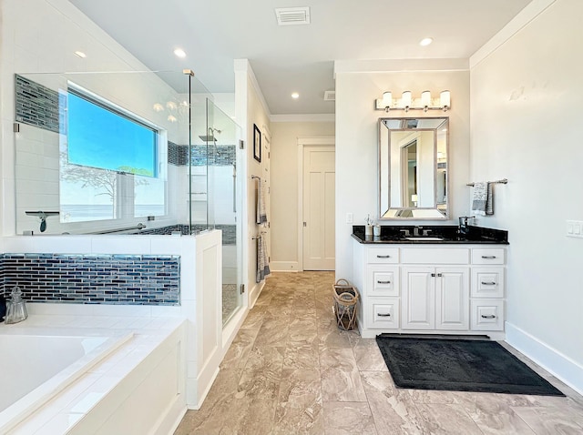 bathroom with vanity, separate shower and tub, and ornamental molding