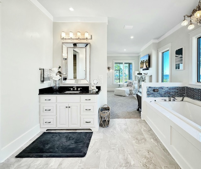 bathroom with vanity, tiled bath, and crown molding