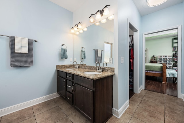 bathroom with tile patterned floors and vanity