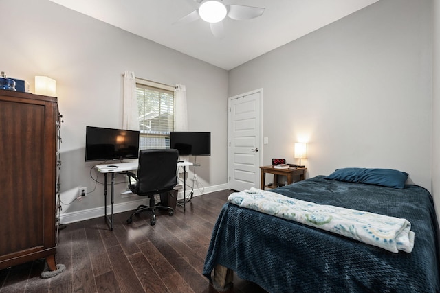 bedroom with ceiling fan, dark wood-type flooring, and lofted ceiling