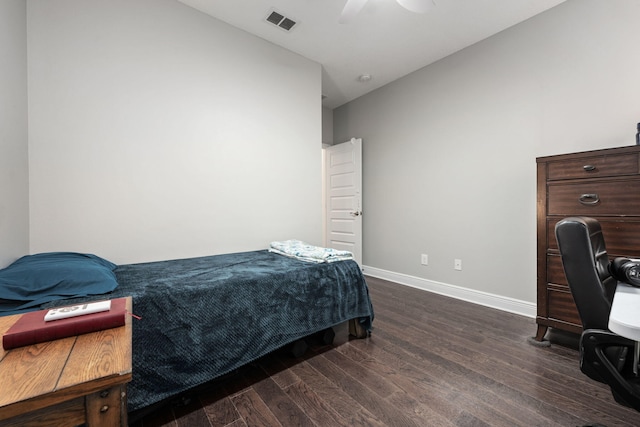 bedroom featuring dark hardwood / wood-style flooring and ceiling fan