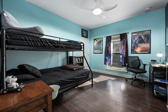 bedroom featuring dark hardwood / wood-style flooring and ceiling fan