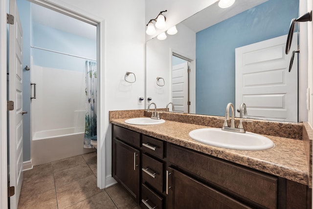 bathroom featuring tile patterned floors, shower / bath combo, and vanity