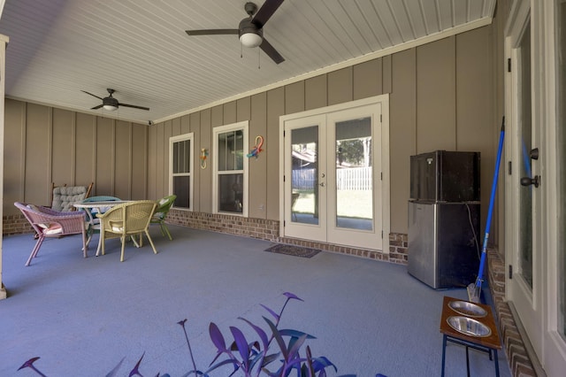 view of patio featuring ceiling fan and french doors