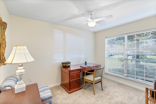 office with light carpet, ceiling fan, and a textured ceiling