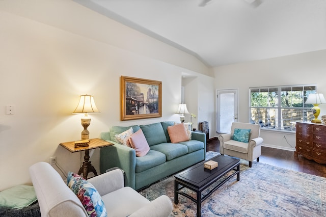 living room with hardwood / wood-style floors and lofted ceiling