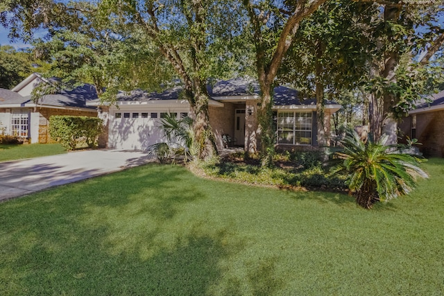 ranch-style home featuring a garage and a front yard