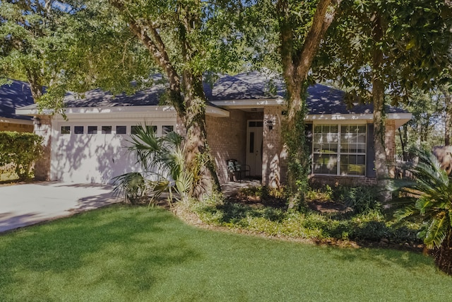 ranch-style house with a front lawn and a garage