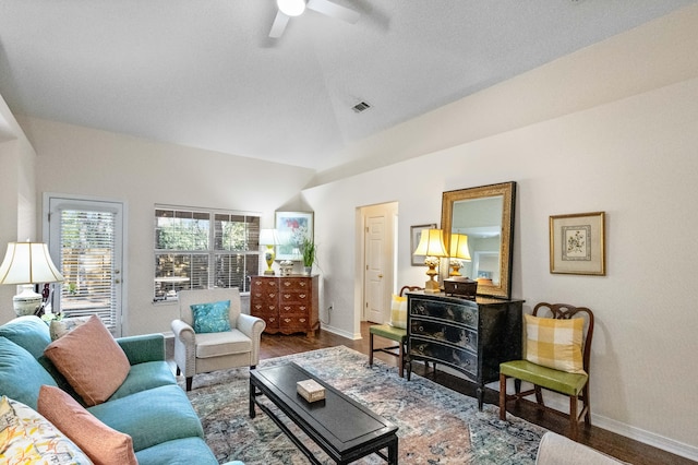 living room with ceiling fan, hardwood / wood-style floors, and lofted ceiling