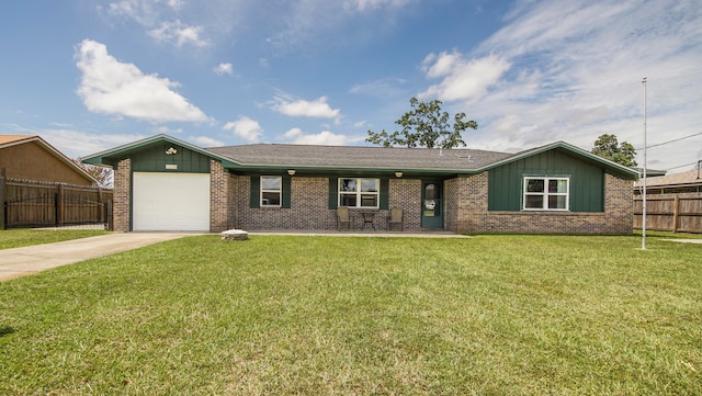 ranch-style house featuring a garage and a front yard