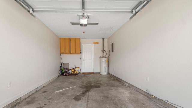 garage featuring electric water heater and a garage door opener