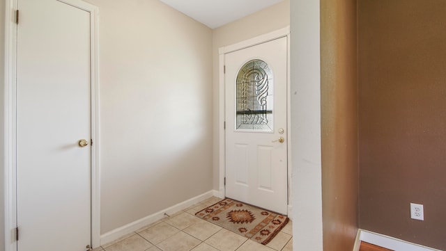 foyer with light tile patterned floors