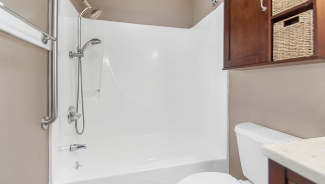 full bathroom featuring vanity, shower / bath combination, and toilet