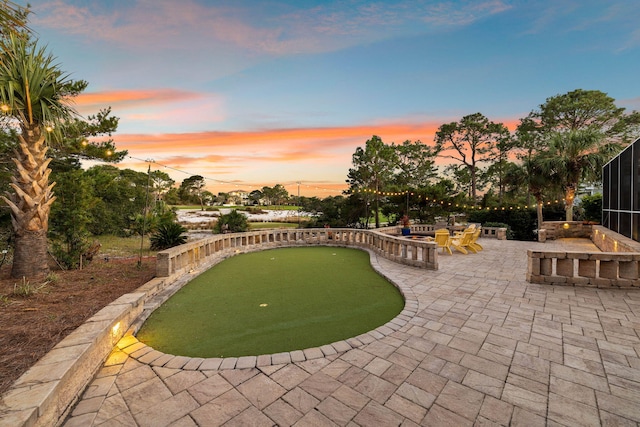 view of patio terrace at dusk