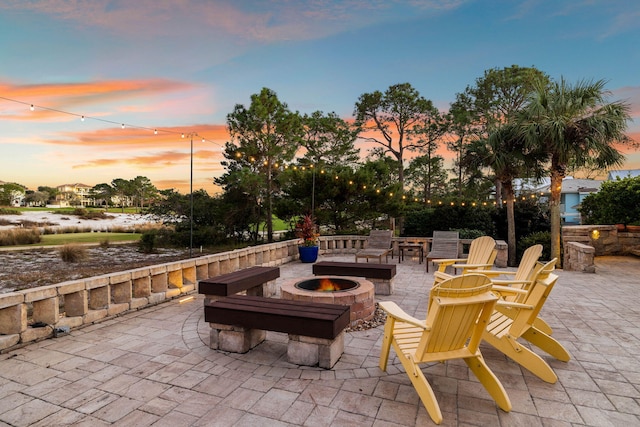 patio terrace at dusk with a fire pit